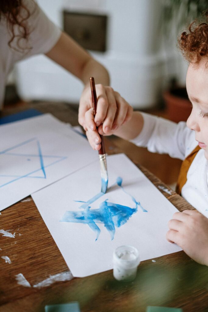 Child with ain't brush. Pexel picture.