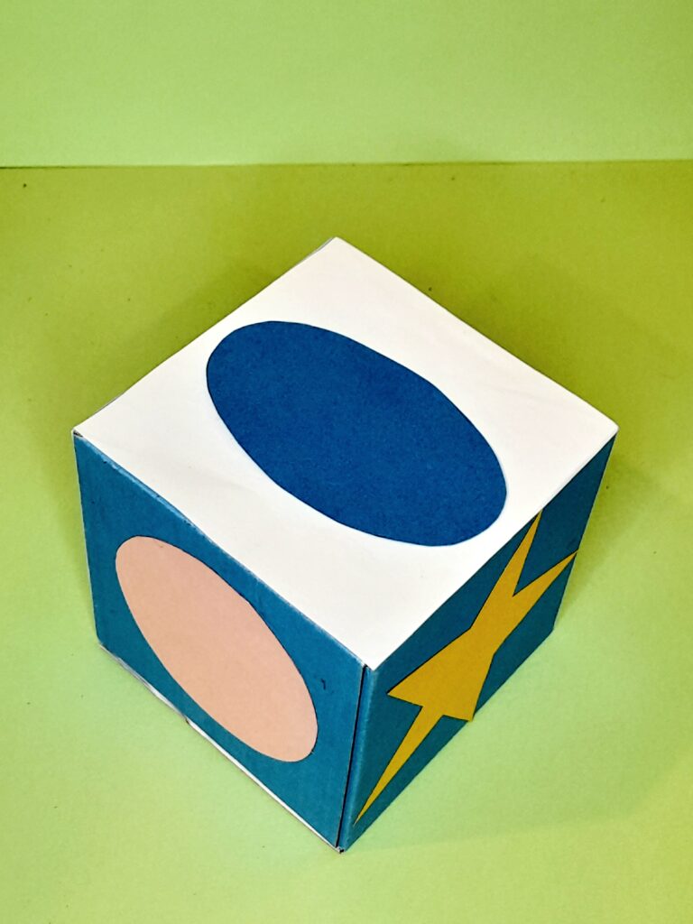 A blue oval, pink circle and yellow star.