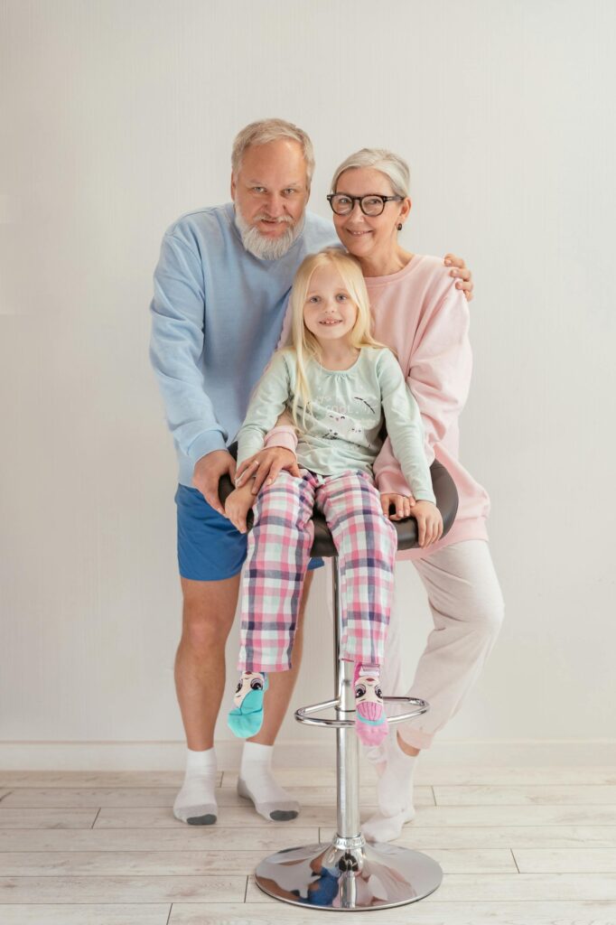 Child with grandparents. Pexel picture, by Mikhail Nilov.