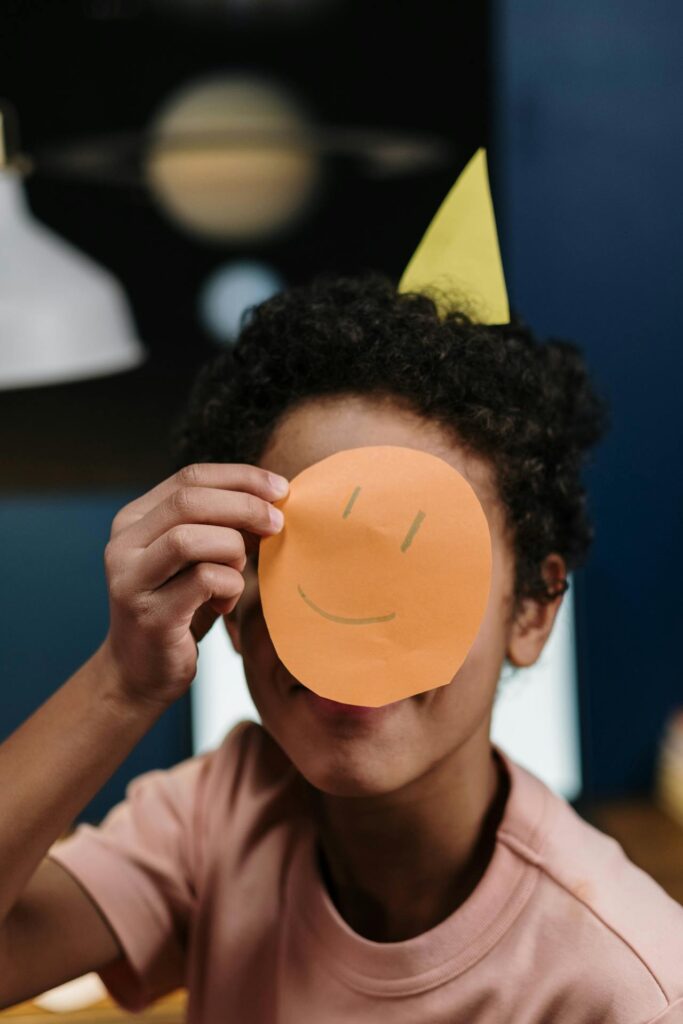 Boy with smiley face. Picture from Pexels.com by Cottonbro Studio