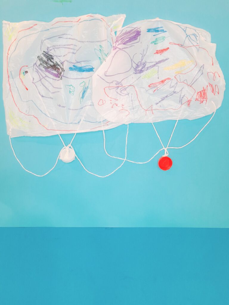 Finished parachutes hovering ready to drop.