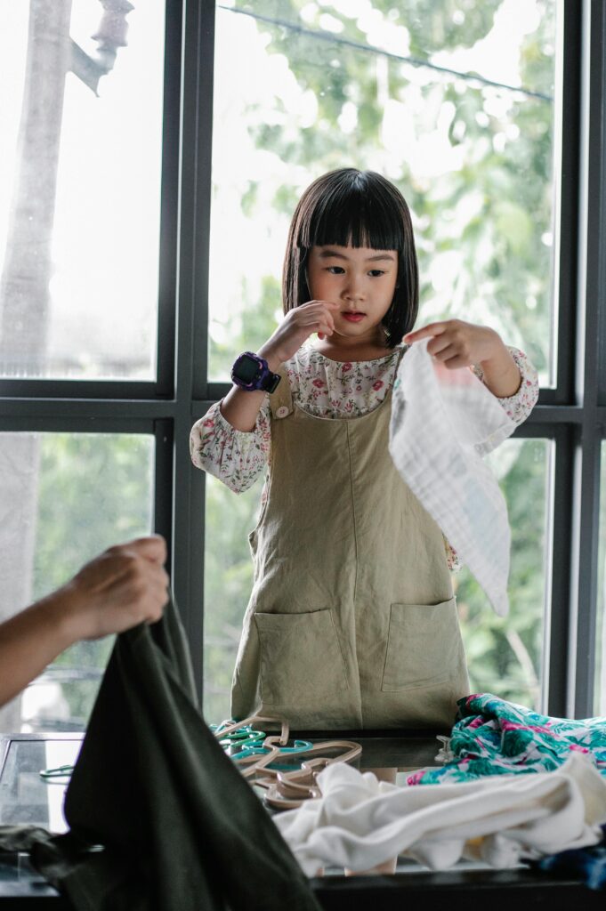 Child holding fabric. A Pexels picture.