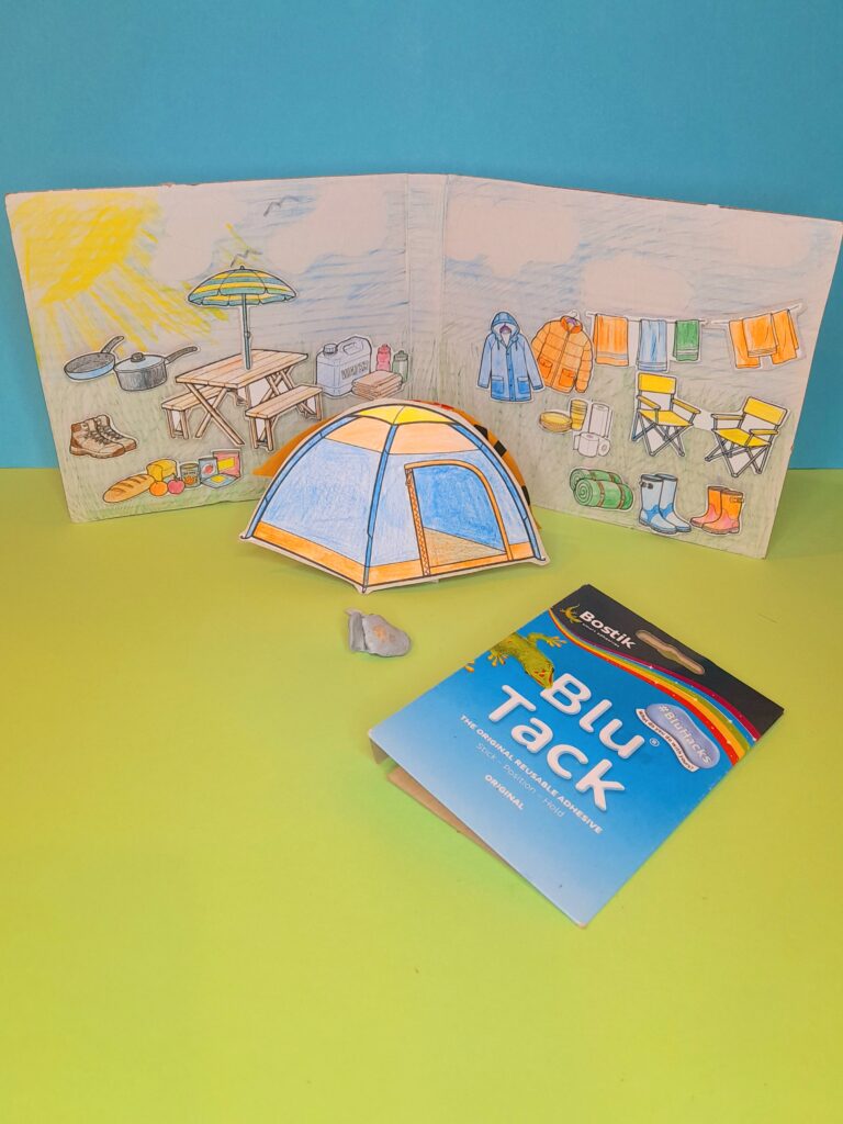 Or attach items on a coloured in backing board, with coloured in a sky and grass base.